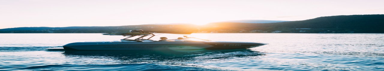 A powerboat on the water at sunset